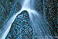 Flowing water split directions on rock at Darwin Falls, Darwin Canyon, Death Valley National Park, California